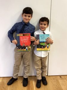 2 Students Holding Up Julia Donaldson Books