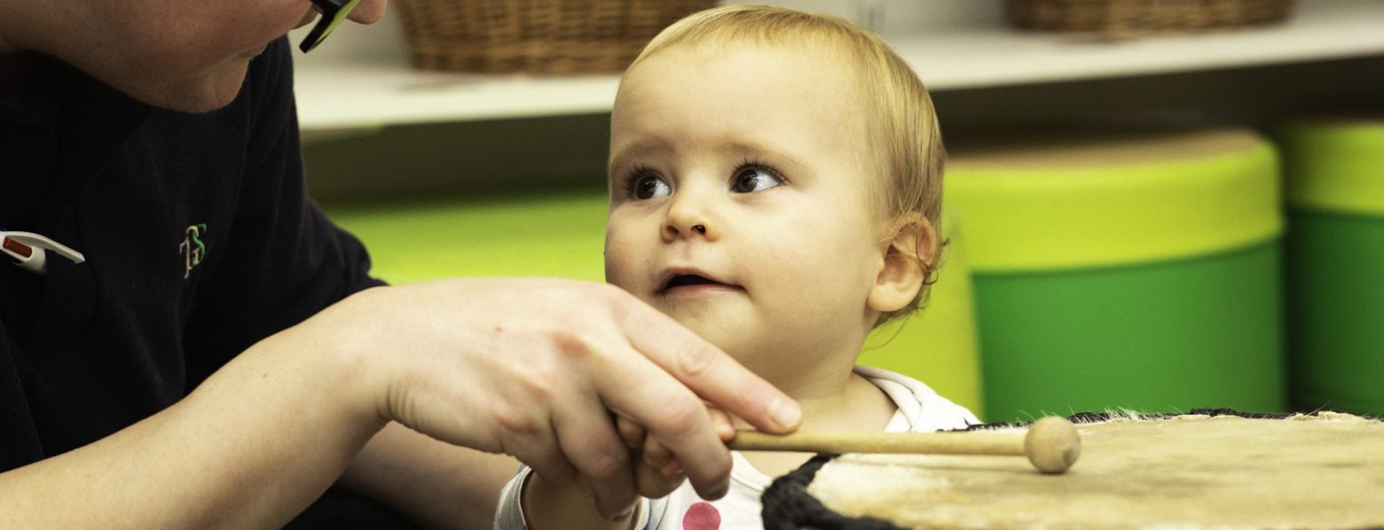 Child Looking at a Drum