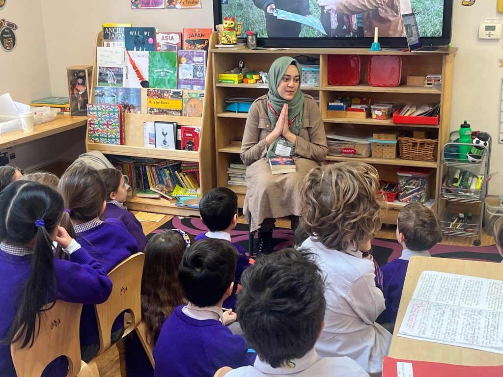 students listening to an author's story
