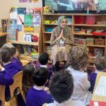 students listening to an author's story